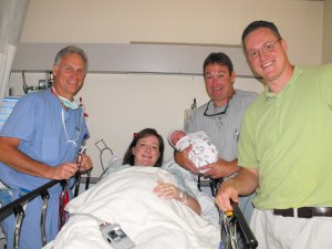 Mike the Anesthesiologist, me, my OB holding the newest Michael, and my husband. P.S. My OB, who is pretty much the greatest one of the planet, was a little miffed we named the baby after the anesthesiologist. He claimed he did all the work. I told him he'd get the next one. Naturally, now he keeps bugging me about when that 