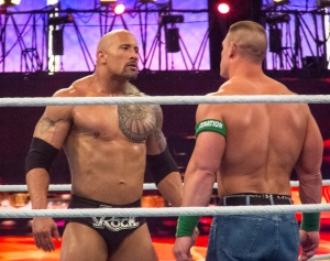 Pretty much what we looked like on the softball field...except with less muscles, more hair, and not such a distinct feeling that we might start kissing. "The Rock Vs. John Cena" by Wikipedia licensed under CC BY 2.0